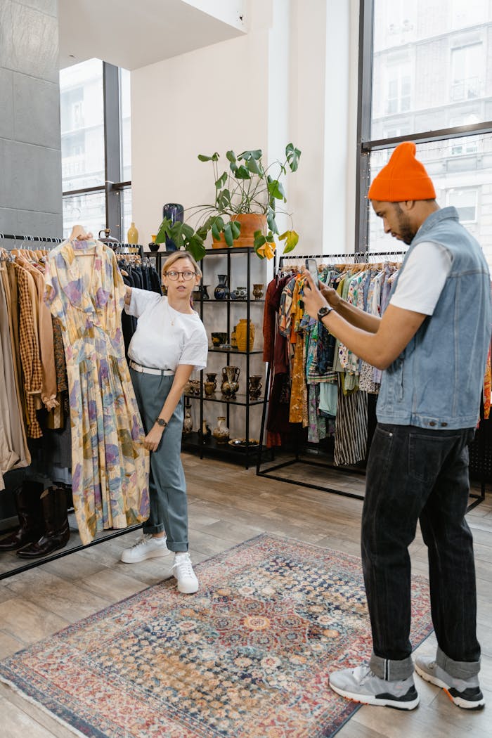 Couple capturing a stylish dress in a trendy boutique, showcasing modern fashion.